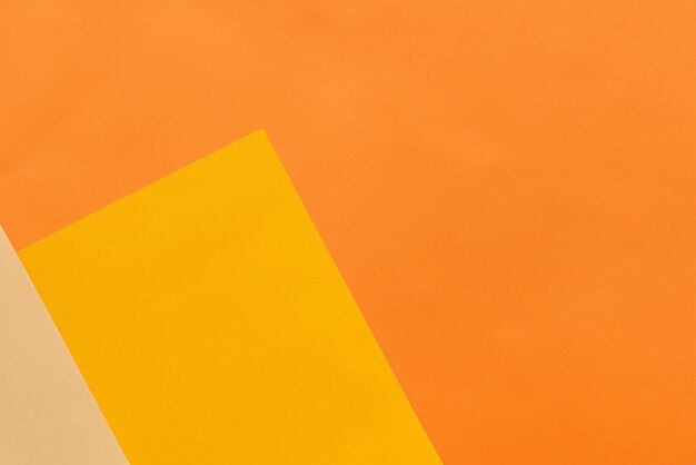 Abstract orange and yellow papers stacking together in abstract form Abstract color paper background