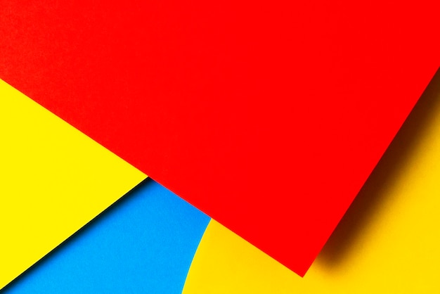 Photo abstract paper texture background minimal geometric shapes and lines in yellow blue red colors