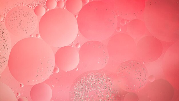 Photo abstract pink colorful background with oil on water surface oil drops in water