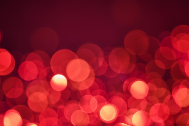 Abstract red bokeh background with blurred round shapes