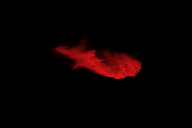 abstract red powder explosion on black background. 