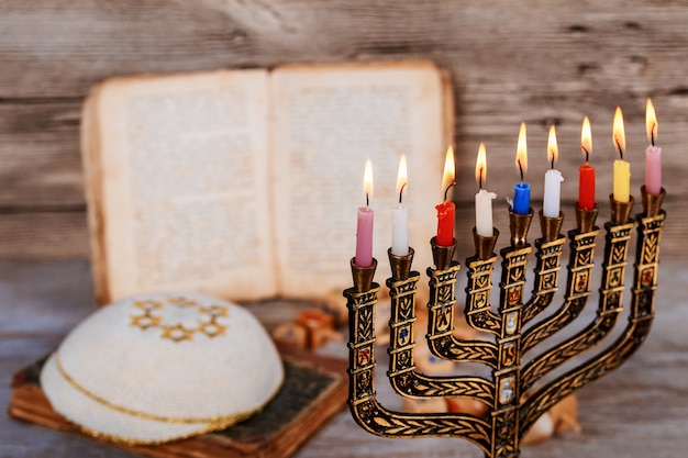 Abstract retro filtered low key image of jewish holiday Hanukkah with menorah traditional Candelabra