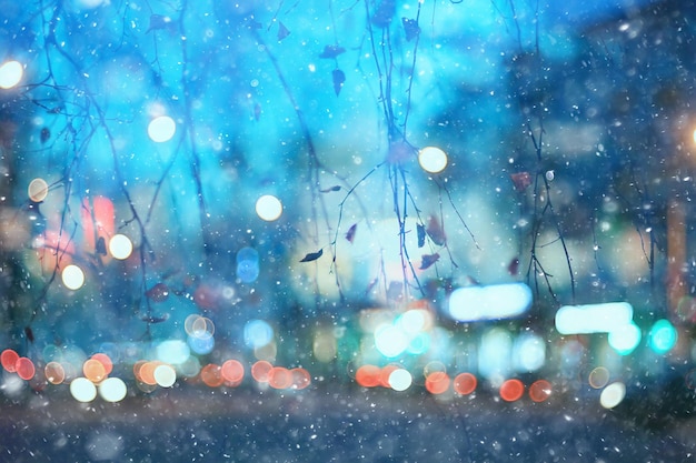 abstract snow blurred background city lights, winter holiday new year