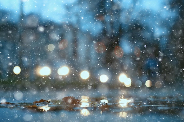 abstract snow blurred background city lights, winter holiday new year