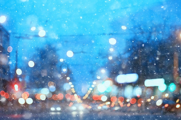 abstract snow blurred background city lights, winter holiday new year