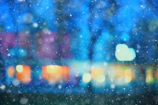 abstract snow blurred background city lights, winter holiday new year