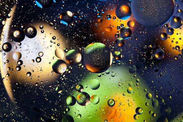 Abstract space background Water drops of different colours