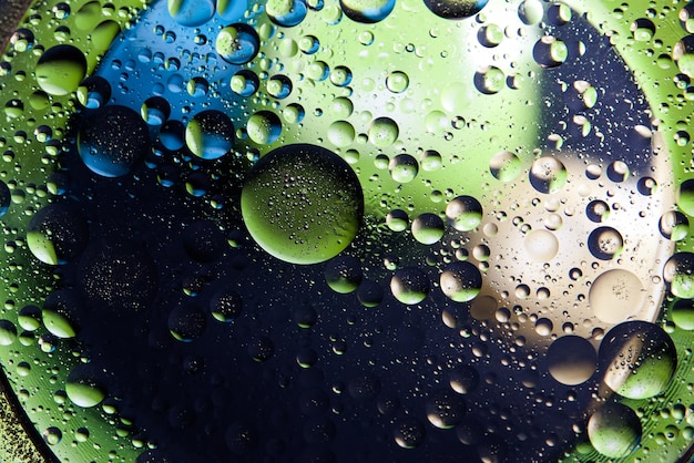 Abstract space background Water drops of different colours