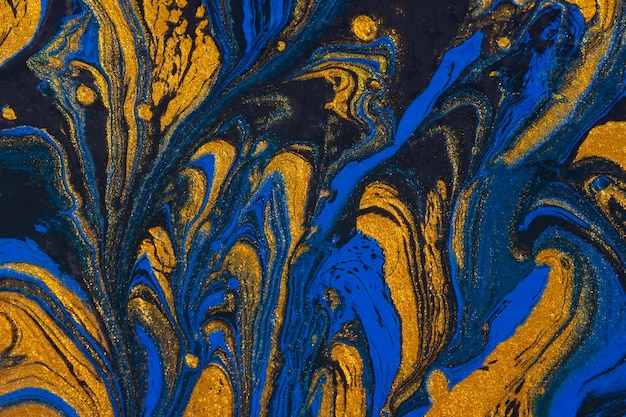 Abstract space blue gold black background Acrylic painting fluid art Golden waves of the ocean