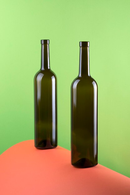 Photo abstract still life with color background and two glass bottles