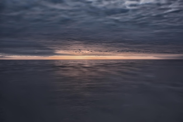 abstract sunset on the lake, landscape water and sky, blurred view freedom nature concept