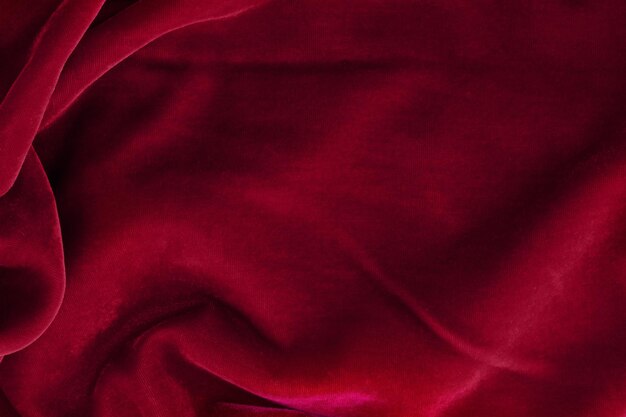 Abstract texture of draped viva magenta velvet background