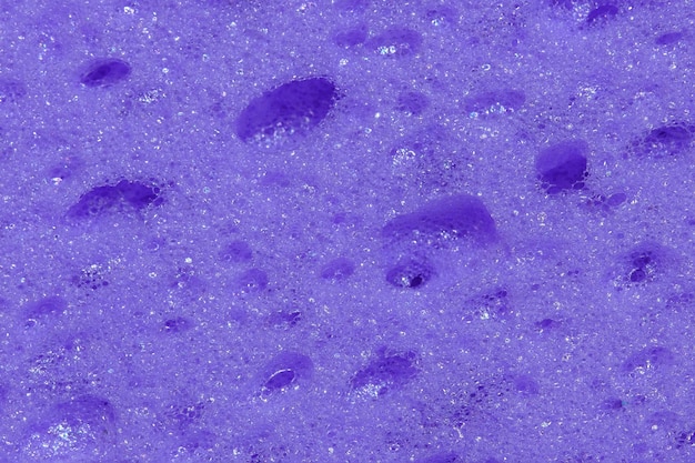 Abstract texture of purple foam rubber washcloth