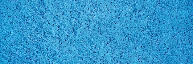 Abstract textured tinted classic blue color surface texture rough background, cement concrete floor or wall.