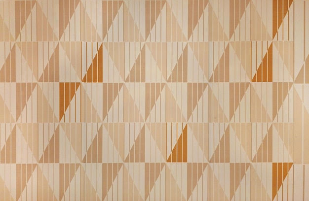 Abstract triangular geometric texture in peach yellow and orange color stacked in diamond pattern