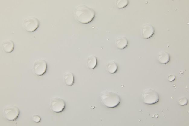 Abstract water drops on grey background macro Bubbles close up