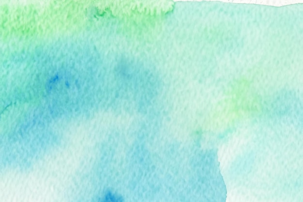 Photo abstract watercolor background with a blend of green and blue colors