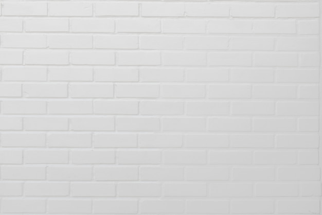 Abstract weathered modern white bricks wall background stucco in rural room . 