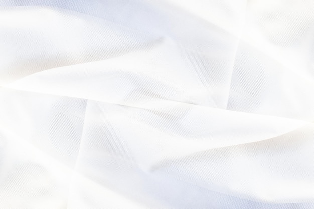 Abstract white background of folded silk fabric