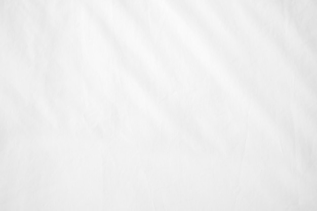 Abstract White Bedding Sheets or White wrinkled fabric background texture and Texture with copyspace Creased or wrinkled white fabricSoft focus