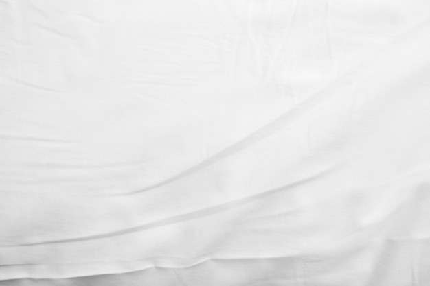 Abstract White Bedding Sheets or White wrinkled fabric background texture and Texture with copyspace Creased or wrinkled white fabricSoft focus