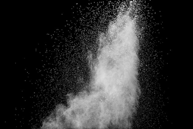 Abstract white powder splatter on black background