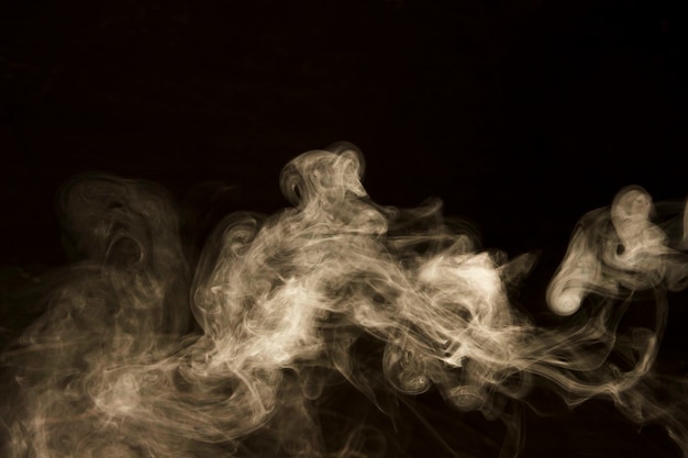 Photo abstract white smoke on black background