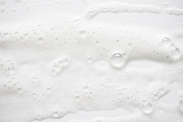 Abstract white soapy foam texture. Shampoo foam with bubbles