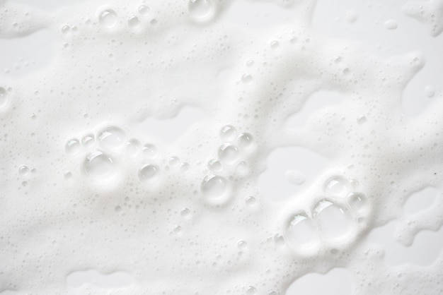 Abstract white soapy foam texture. Shampoo foam with bubbles