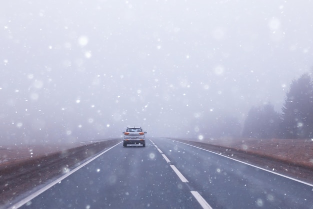 abstract winter road fog snow, landscape view in november transport