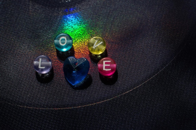 Abstract the word love written with colorful beads