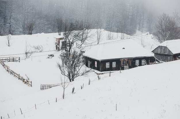 An abundant snowfall in the Romanian Carpathians in the village of Sirnea,