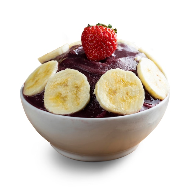 Acai Brazilian frozen acai berry ice cream bowl with banana slices and strawberry Isolated on white background