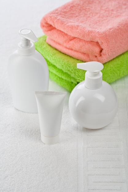 Accessories for bathing on white towel