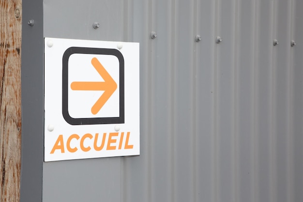 Accueil text sign french on entrance means welcome reception place with orange arrow