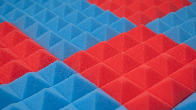 Acoustic foam panel background with red and blue lighting Music background