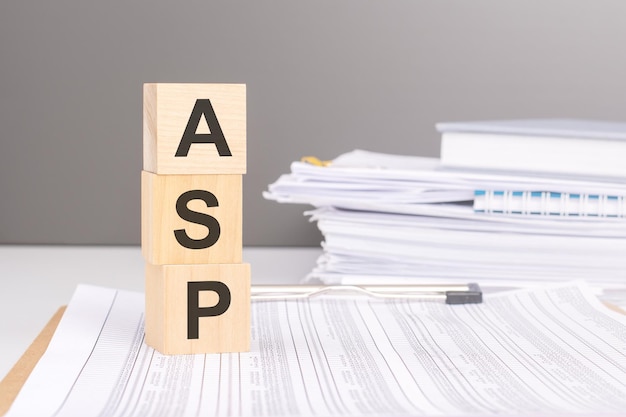 acronym ASP on wooden blocks business concept gray background financial document