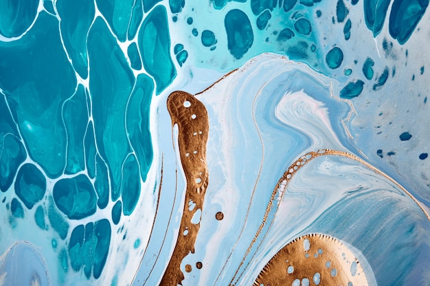 Acrylic Fluid Art Liquid gold on blue waves and spots Abstract marble background or texture