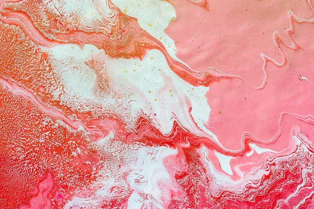 Acrylic Fluid Art. White, red and pink liquid mix and golden splashes. Abstract marble background or texture.