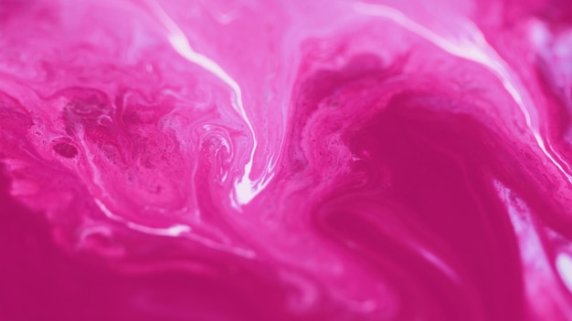 Acrylic paint drip water dye defocused pink white color pigment powder particles ink fluid splash