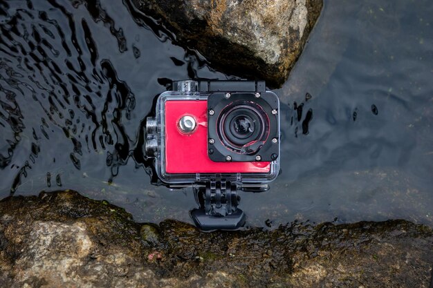 Action camera in the water in a protected waterproof case