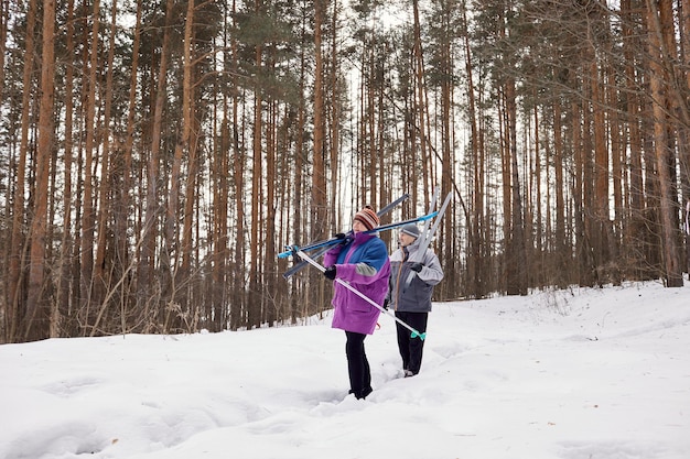 An active elderly couple is engaged in skiing