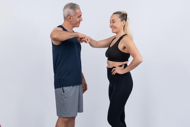 Active and fit physique senior people portrait with happy smile on isolated background Healthy lifelong senior couple with fitness healthy and sporty body care lifestyle concept Clout