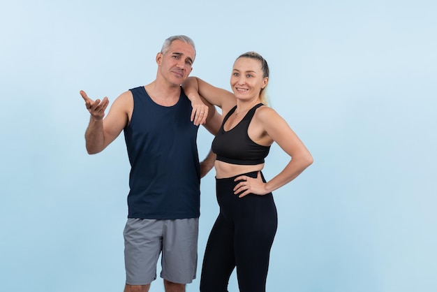 Active and fit physique senior people portrait with happy smile on isolated background Healthy lifelong senior couple with fitness healthy and sporty body care lifestyle concept Clout