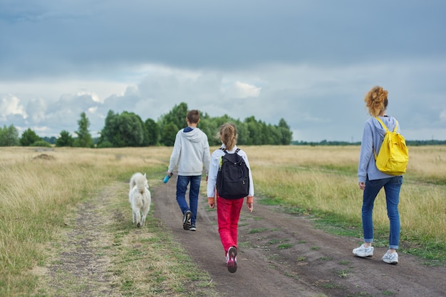 Active healthy lifestyle, children outdoors with dog