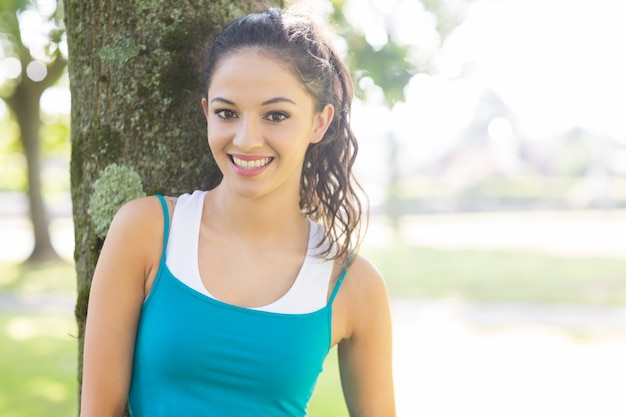 Active smiling brunette looking at camera