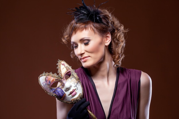 Photo actress posing with mask concept of twoface