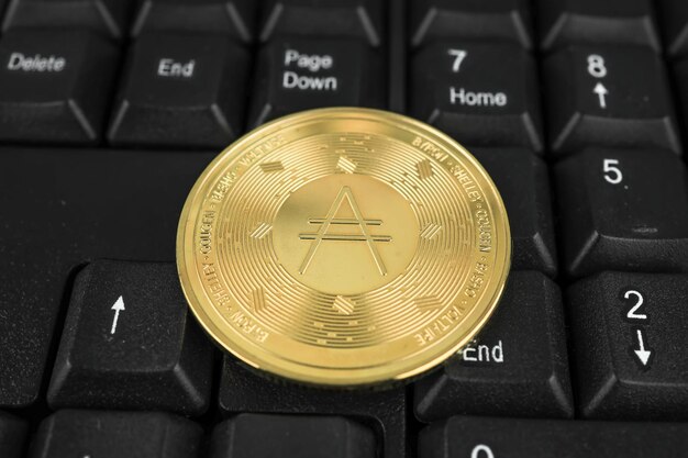 Ada cardano coin on black keyboard Cryptocurrency stock market concept The concept of virtual money