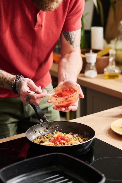 Adding Tomato Sauce Into Pan