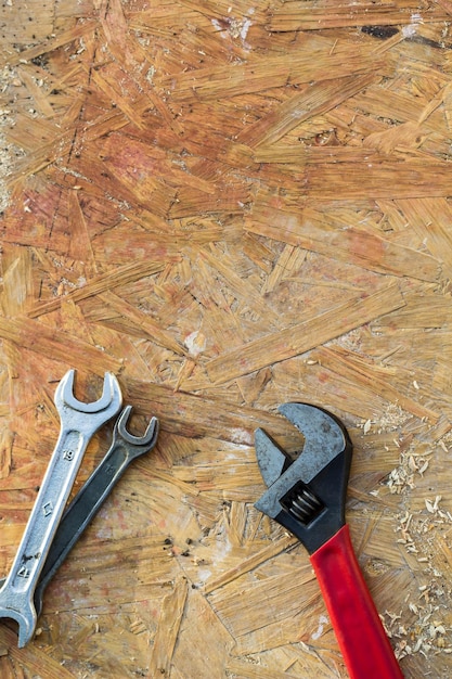 Adjustable wrench spanner tools on wooden table